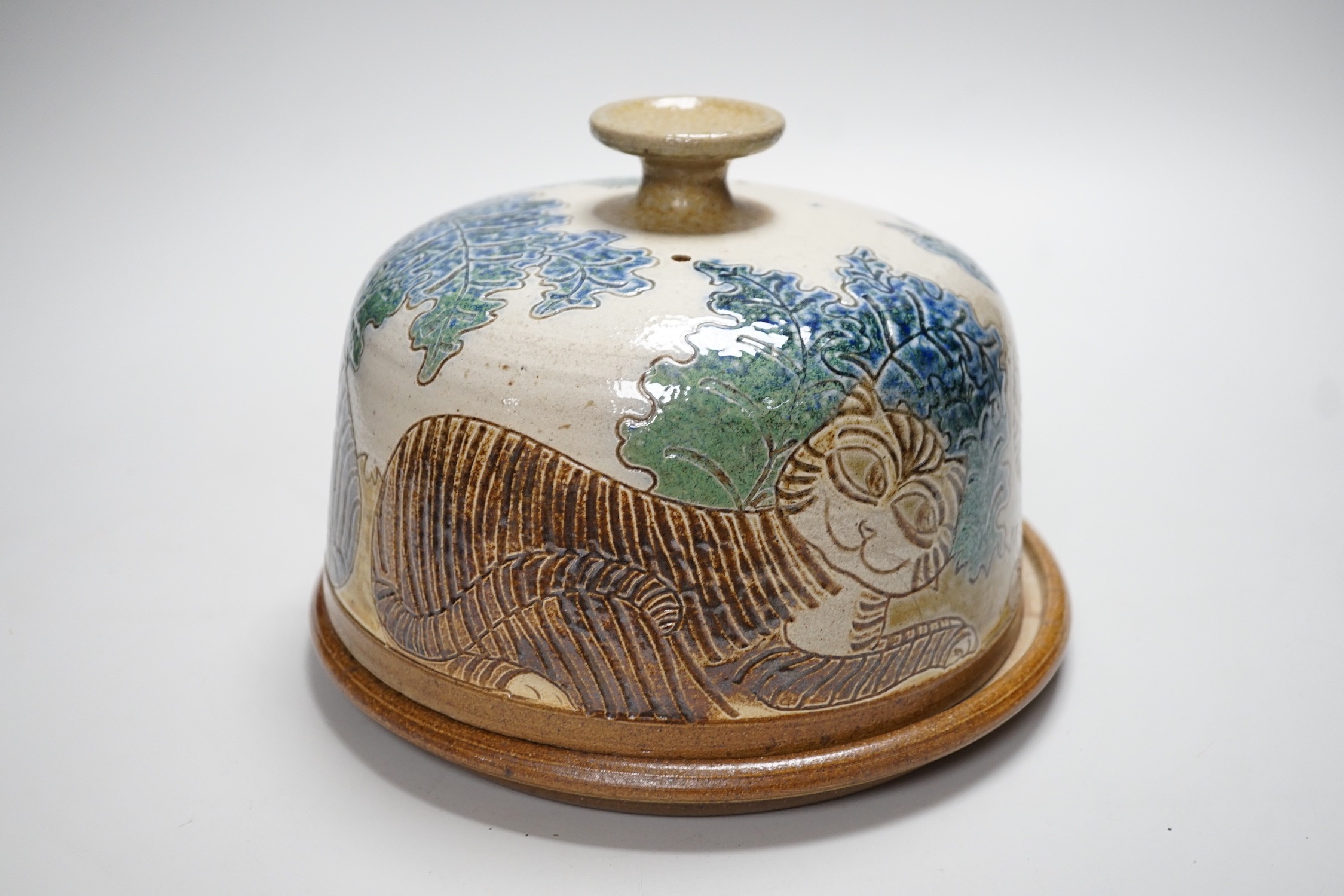 Michael Mosse, a studio pottery cheese dish and cover, decorated with cats, 16cms high